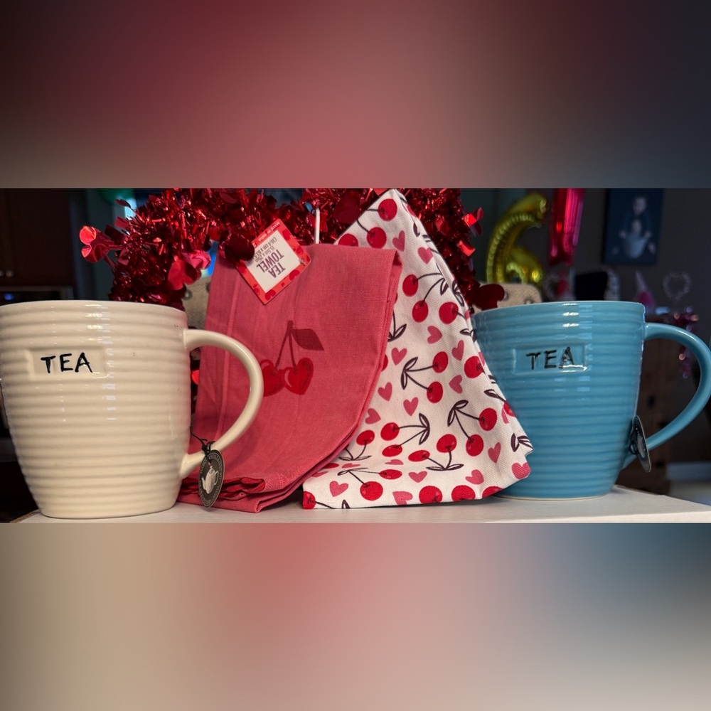 Blue & Cream Tea Mugs along with a set of colorful cherry tea towels.